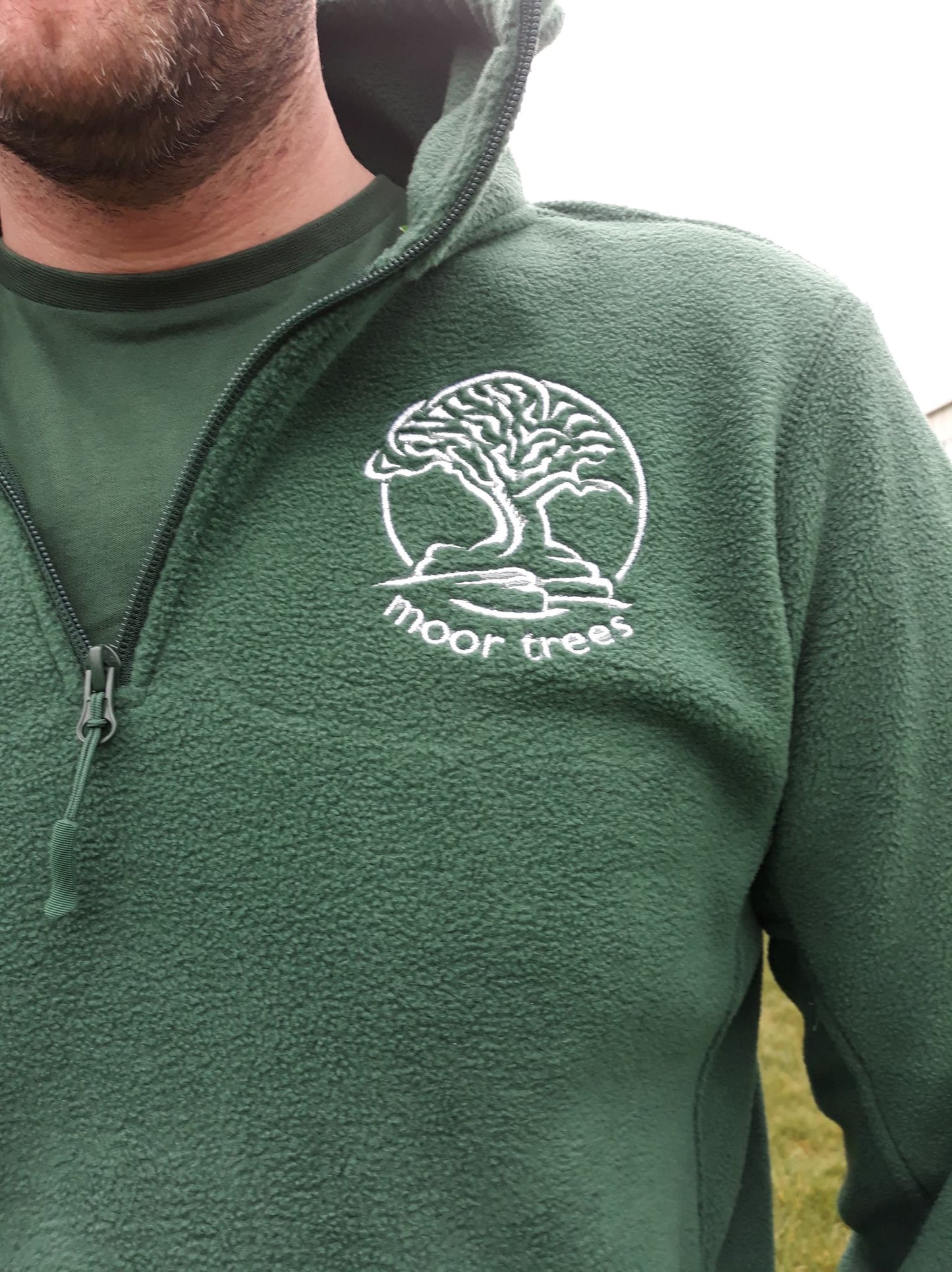 Unisex half zip fleece hoodie embroidered with Moor Trees logo